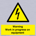 warning-work-in-progress-on-equipmentwith-electrical-hazard-symbol~